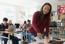 Photo of high school student and teacher in classroom