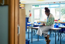 Photo of teacher setting up classroom