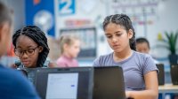 Photo of middle school students working on computers in classroom